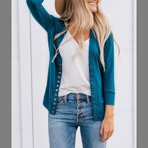 Women’s turquoise snap cardigan, size Medium